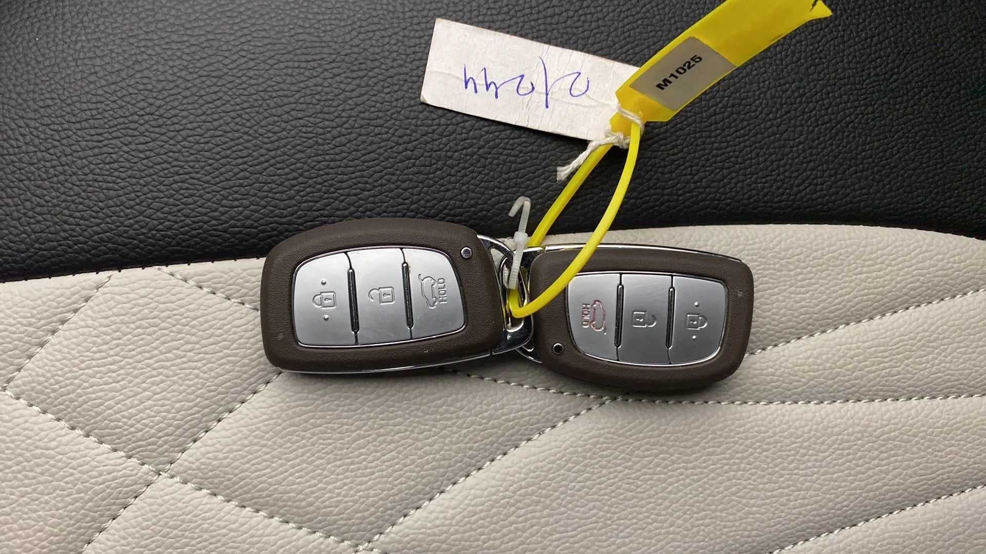 Car key fobs on the seat of a Hyundai Venue