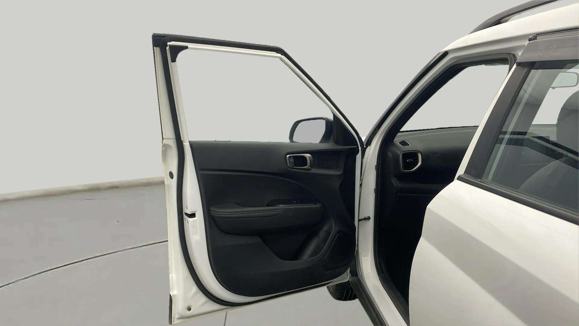 Open front driver door of a Hyundai Venue