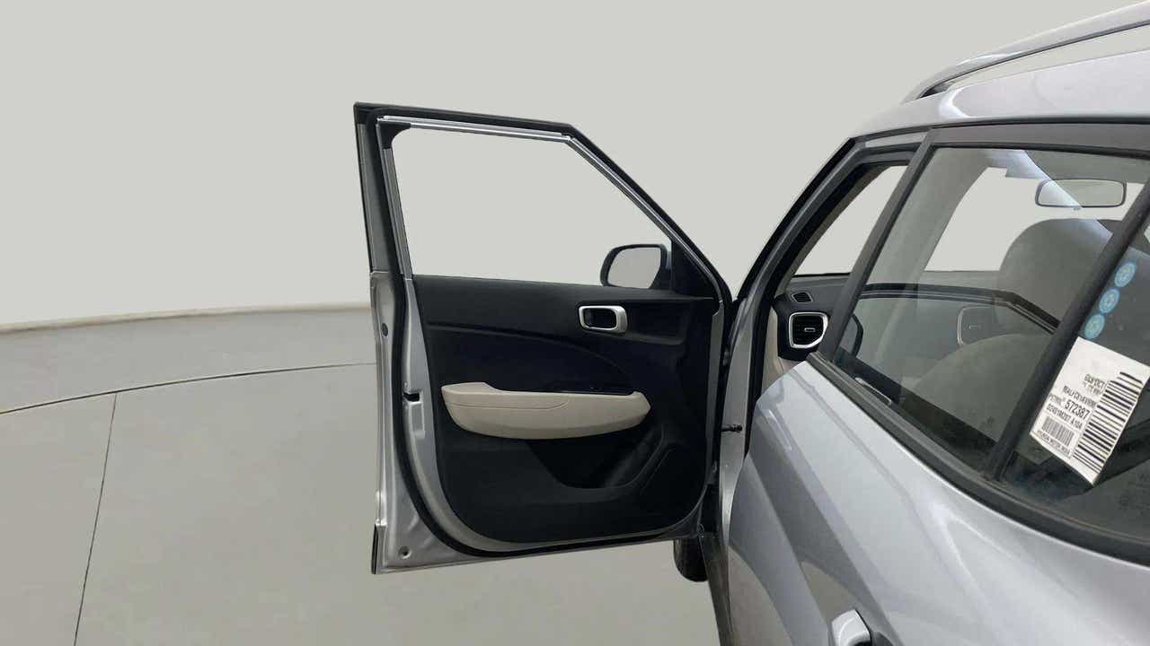 Open front left door view of a Hyundai Venue