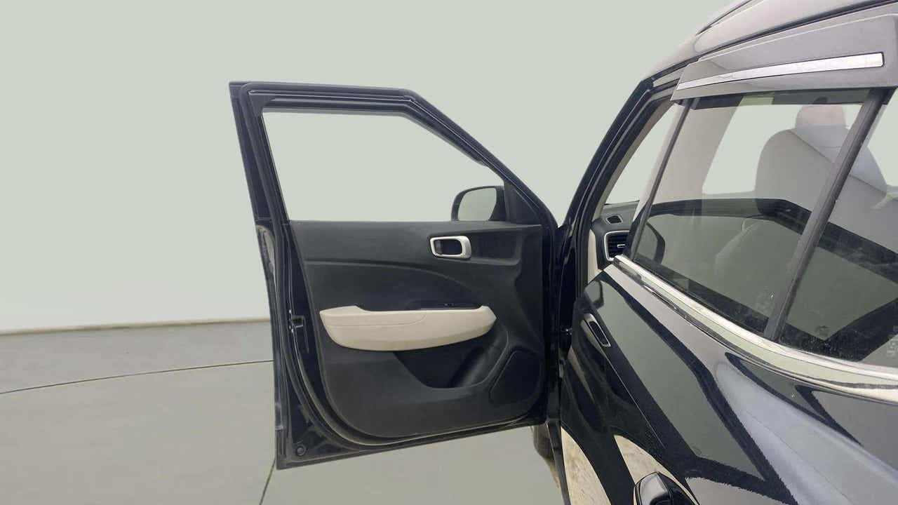 Front door open view of a Hyundai Venue