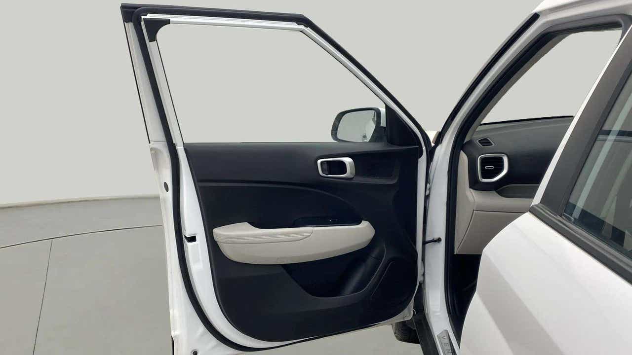 Interior front left door panel of a Hyundai Venue