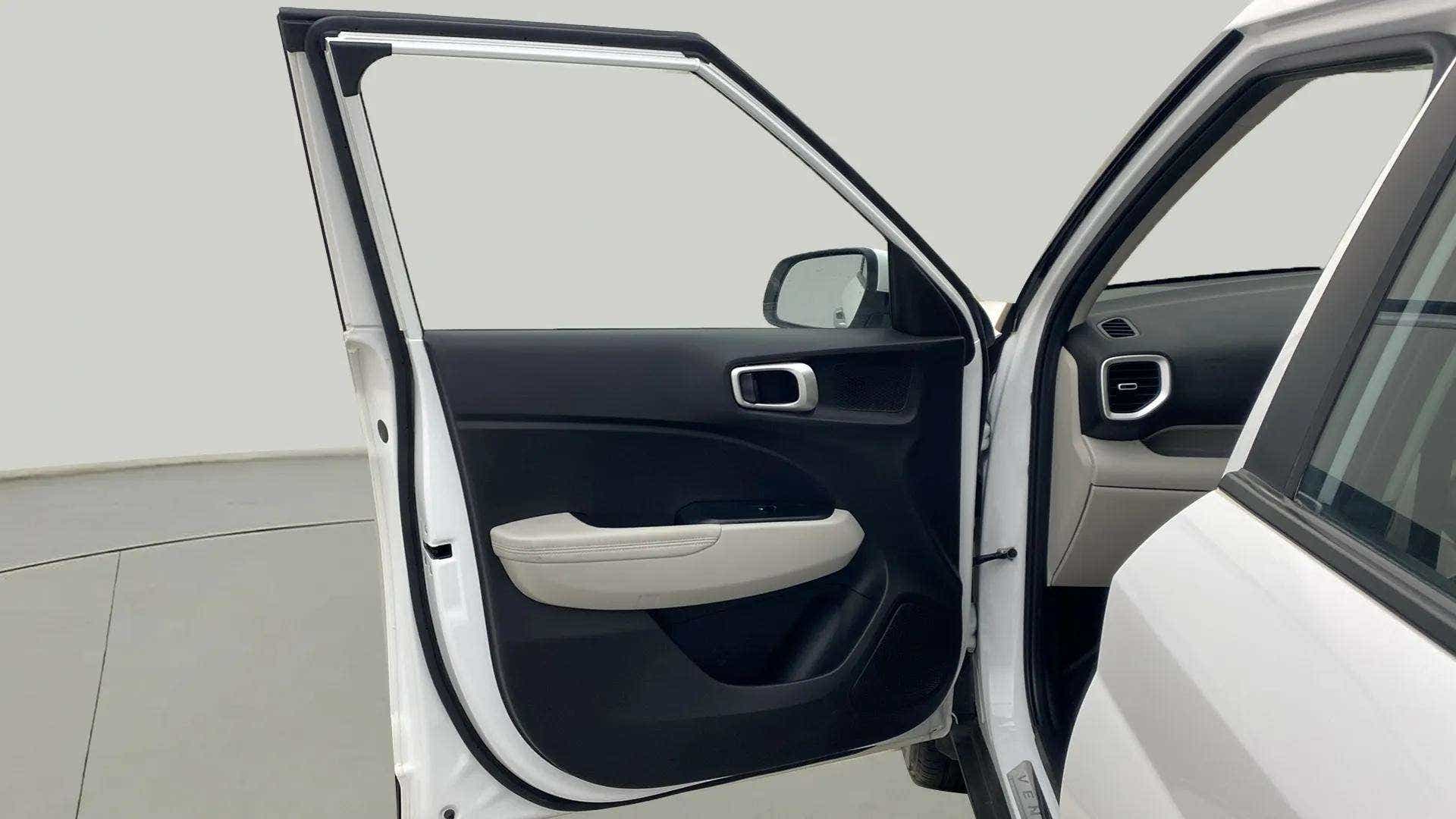 Interior front left door panel of a Hyundai Venue