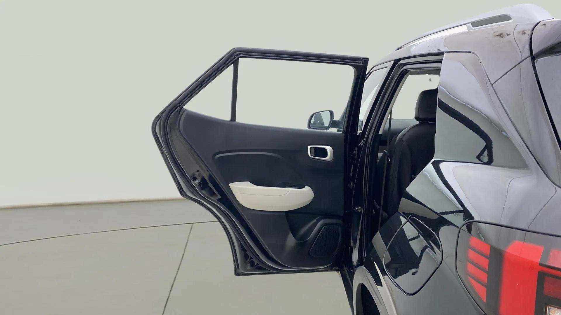 Rear door open view of a Hyundai Venue