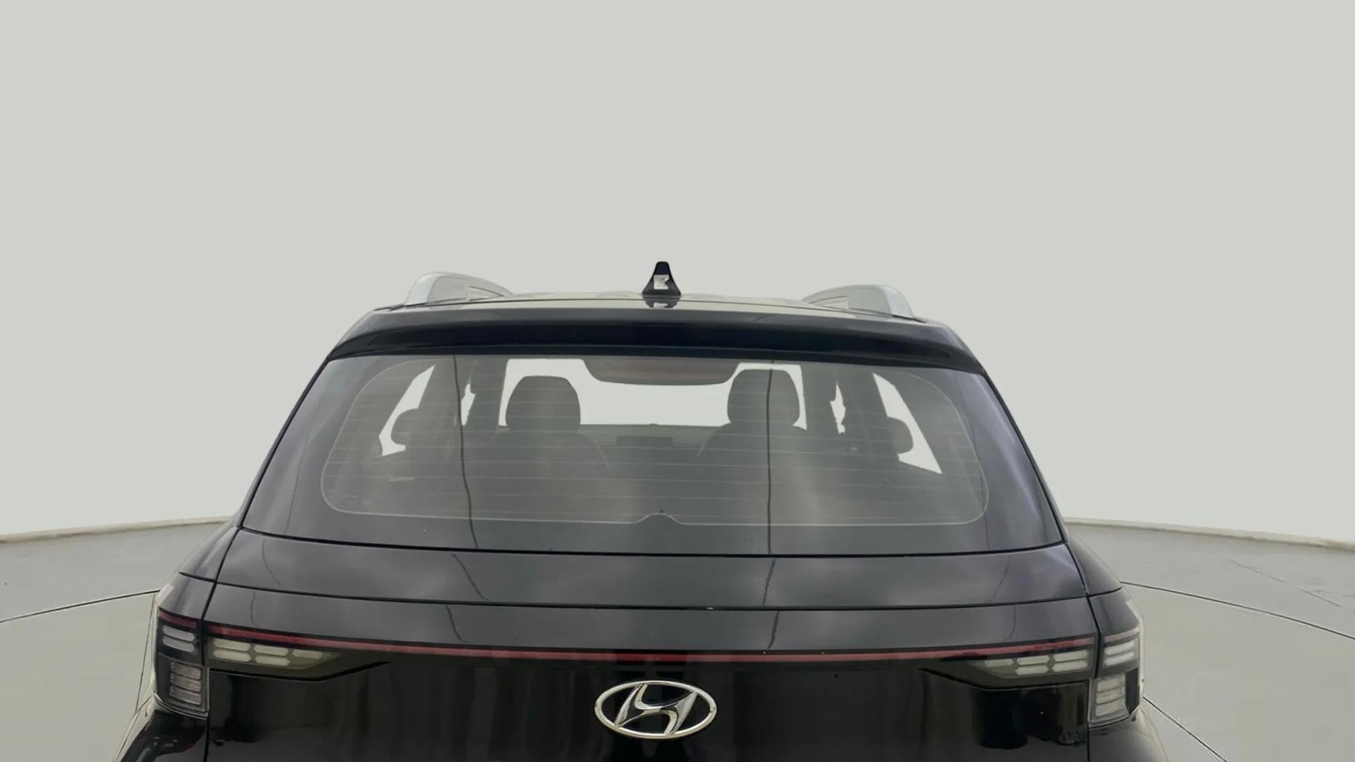 Rear view of a Abyss Black Hyundai Venue