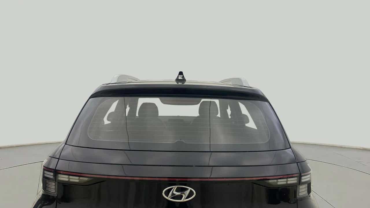 Rear view of a Abyss Black Hyundai Venue