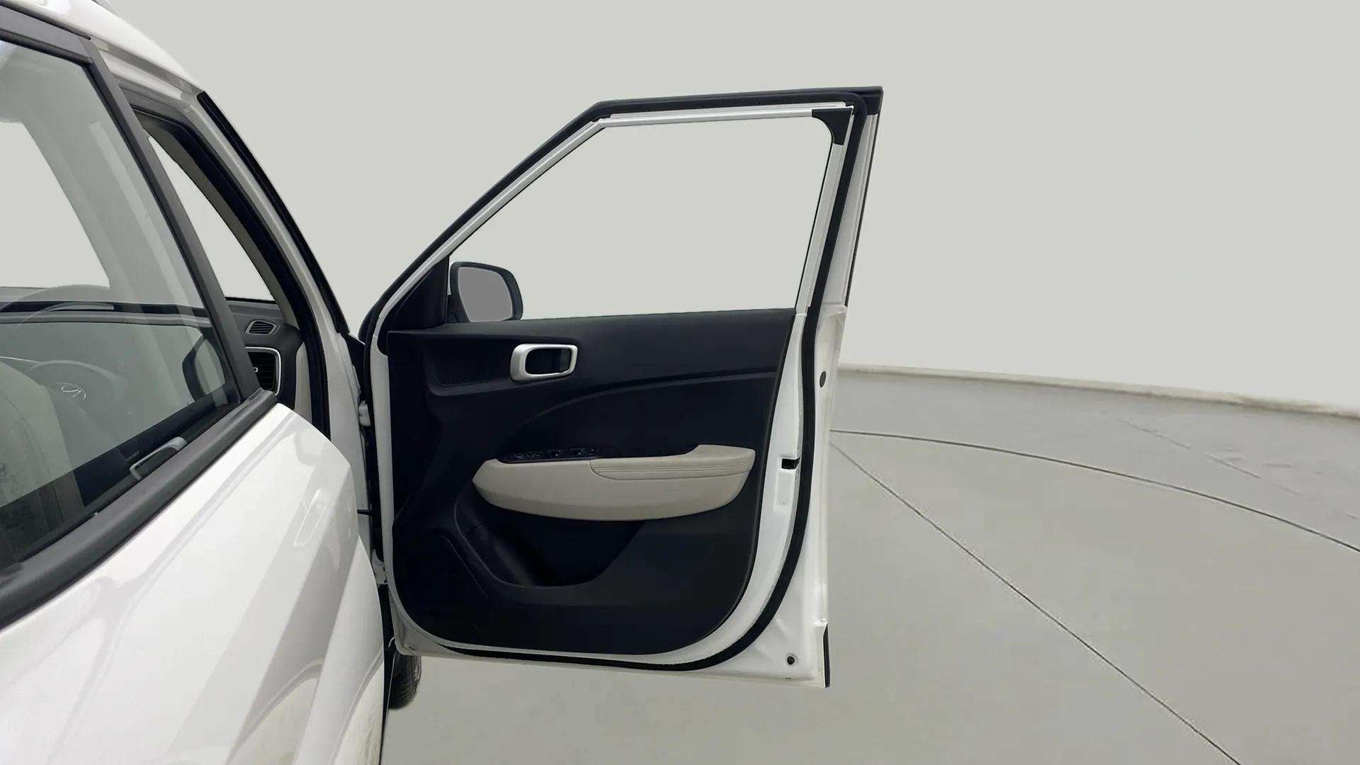 Front door open view of a Hyundai Venue