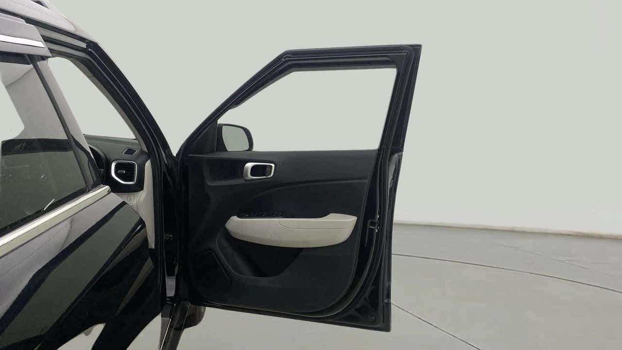 Front driver side door open view of a Hyundai Venue