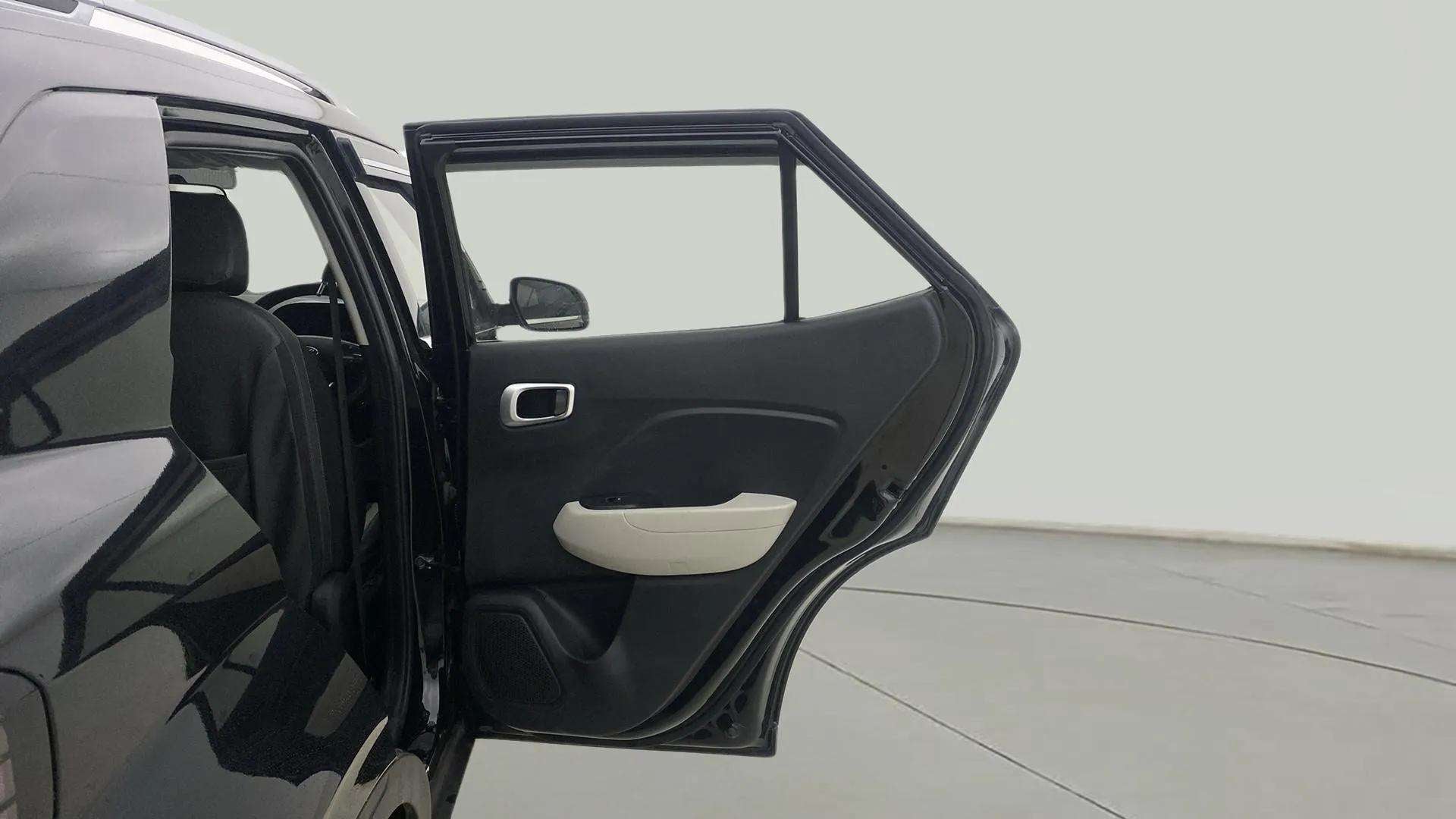 Rear door open view of a Hyundai Venue