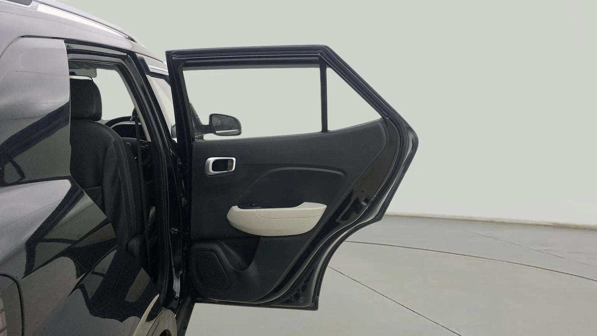 Rear door open view of a Hyundai Venue