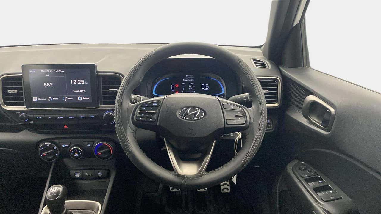 Dashboard and steering wheel view of a Hyundai Venue