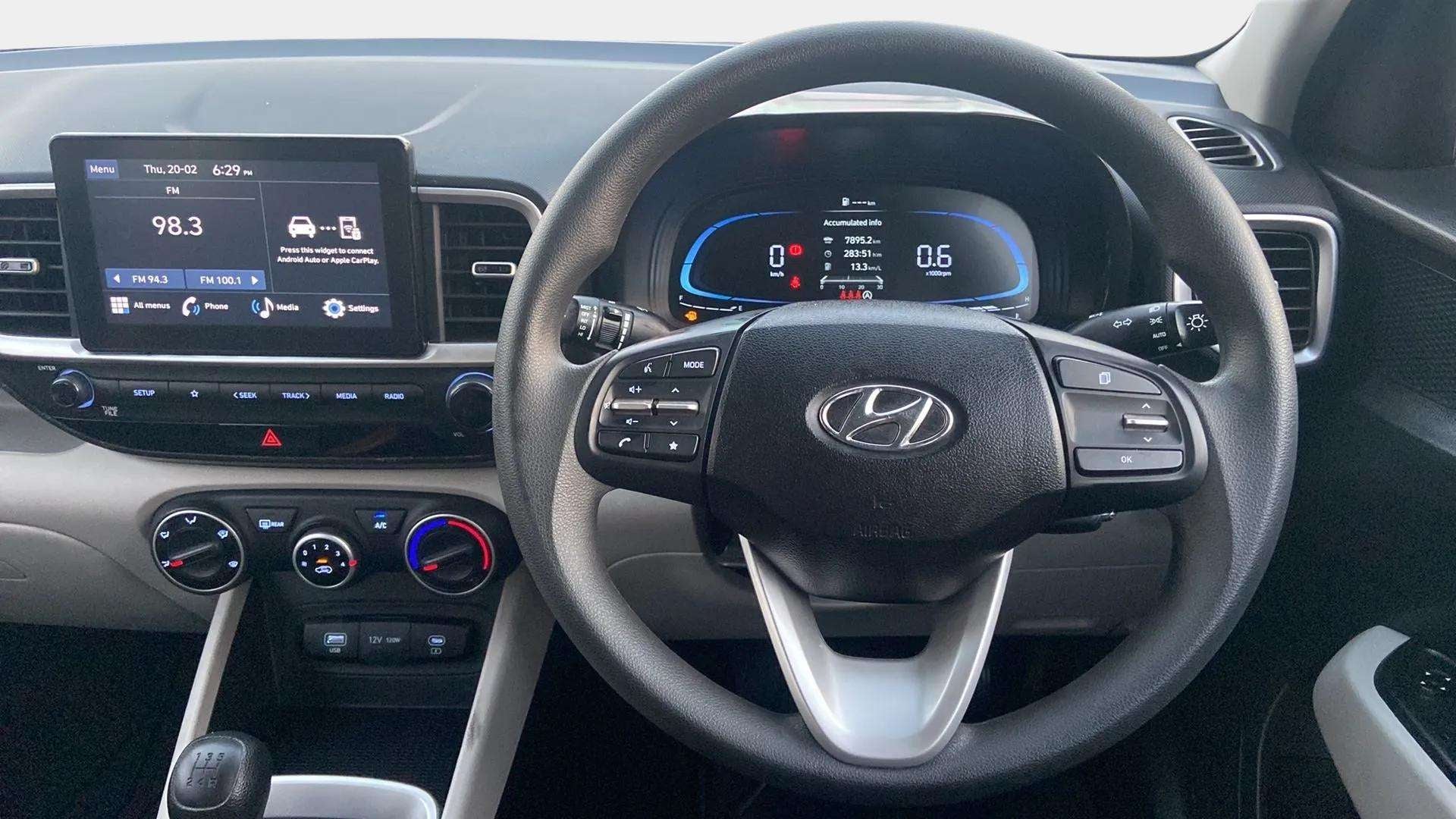 Interior dashboard and steering wheel view of a Hyundai Venue