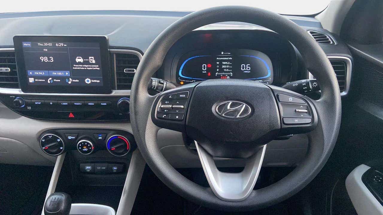 Interior dashboard and steering wheel view of a Hyundai Venue
