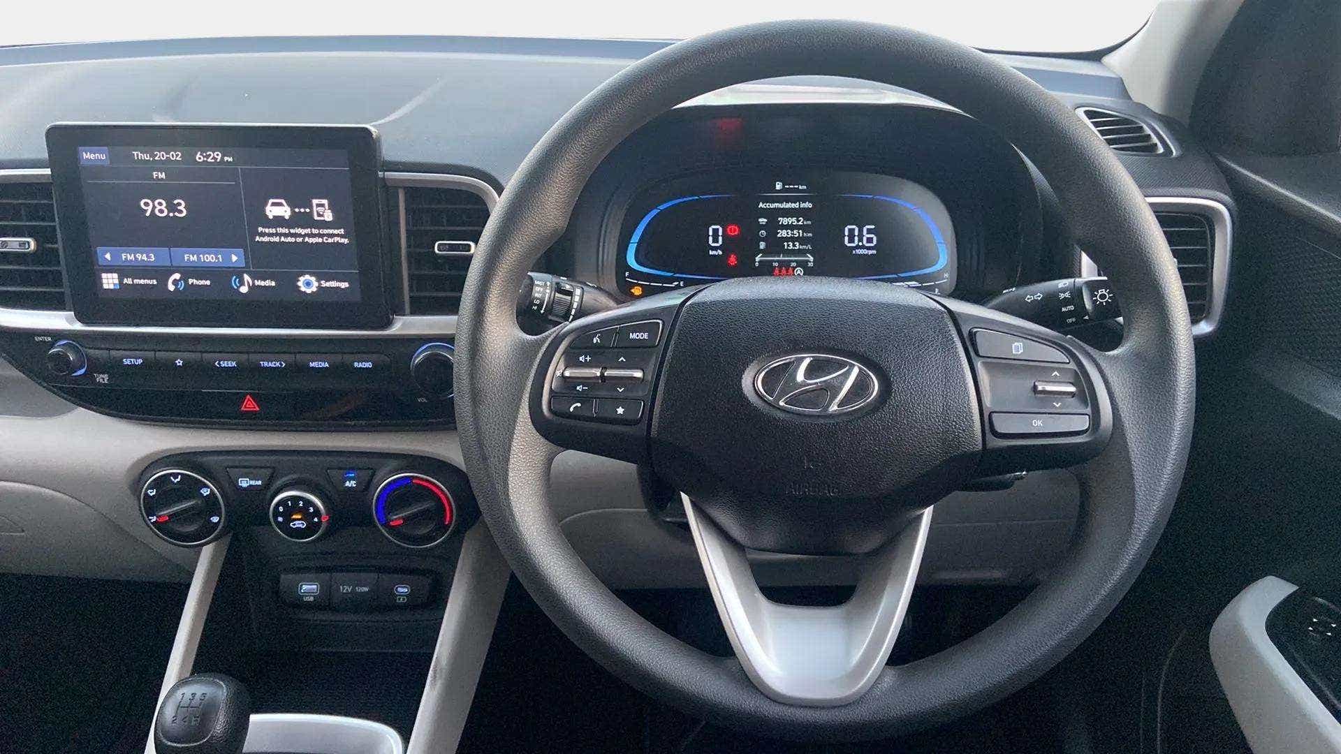 Interior dashboard and steering wheel view of a Hyundai Venue