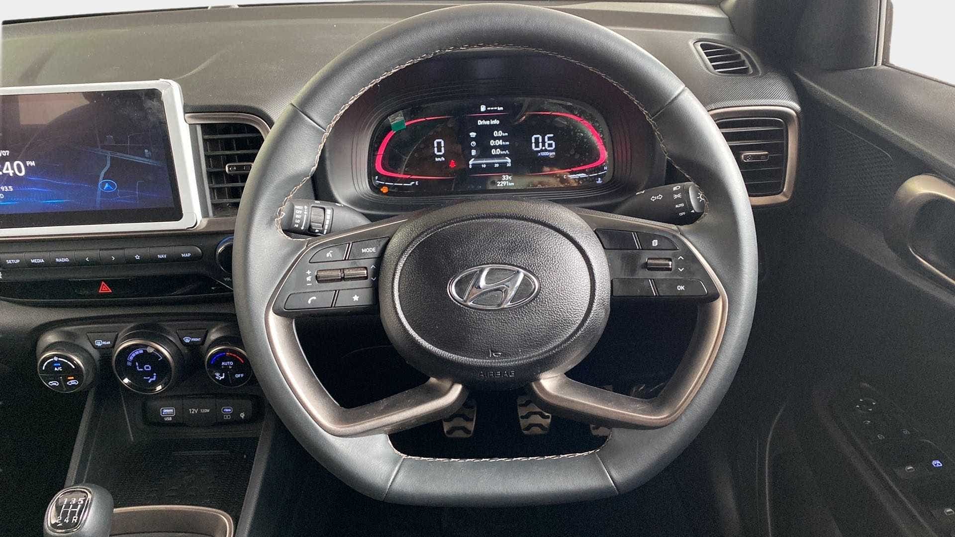 Steering wheel and dashboard view of a Hyundai Venue
