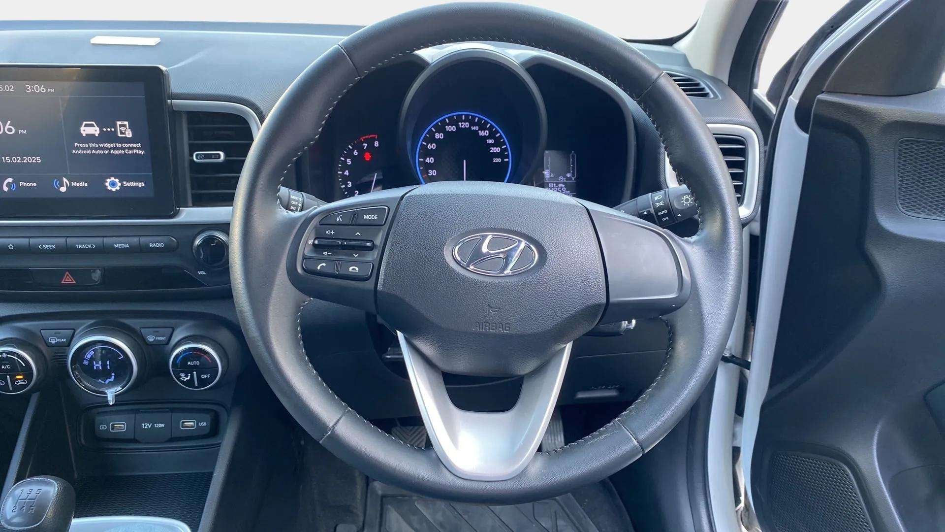 Steering wheel and dashboard view of a Hyundai Venue