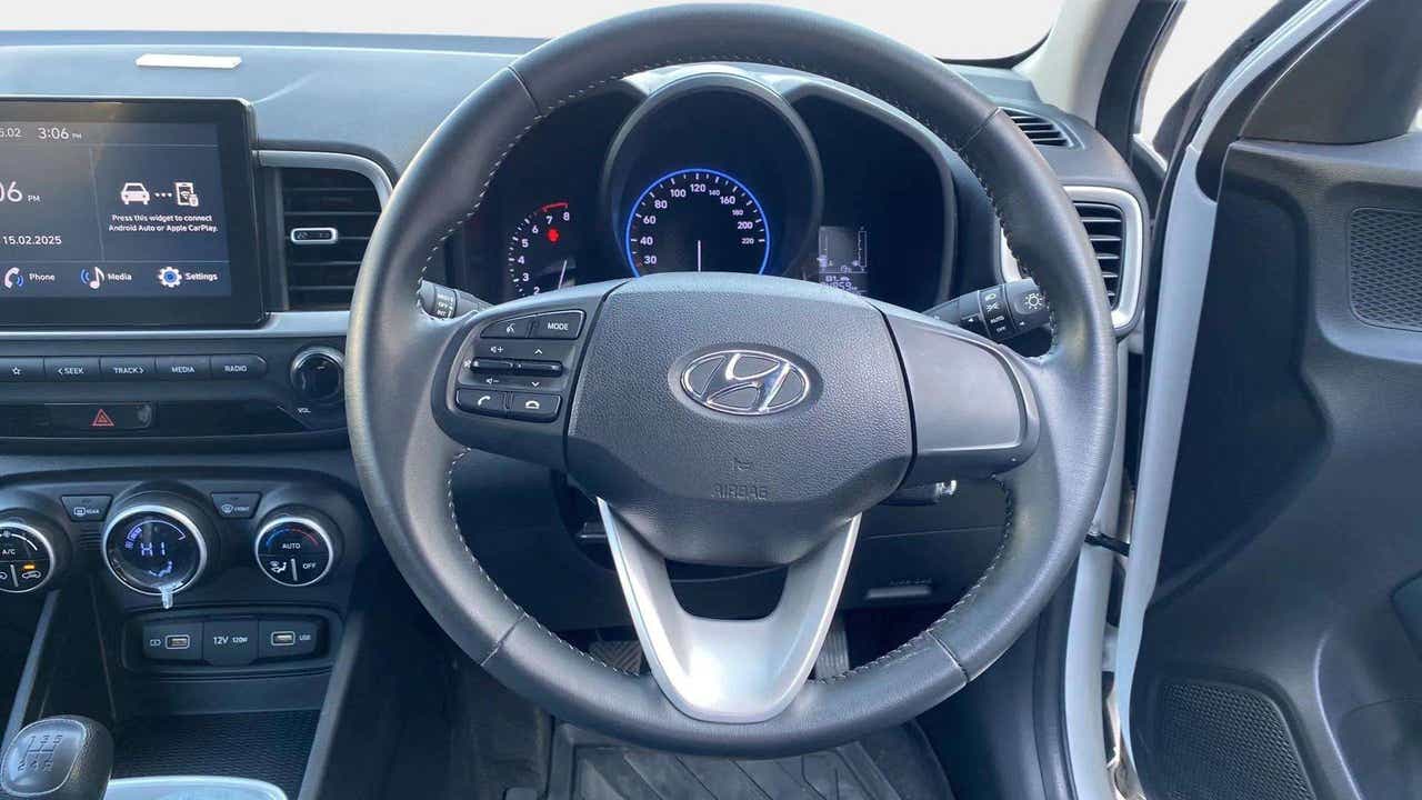 Steering wheel and dashboard view of a Hyundai Venue