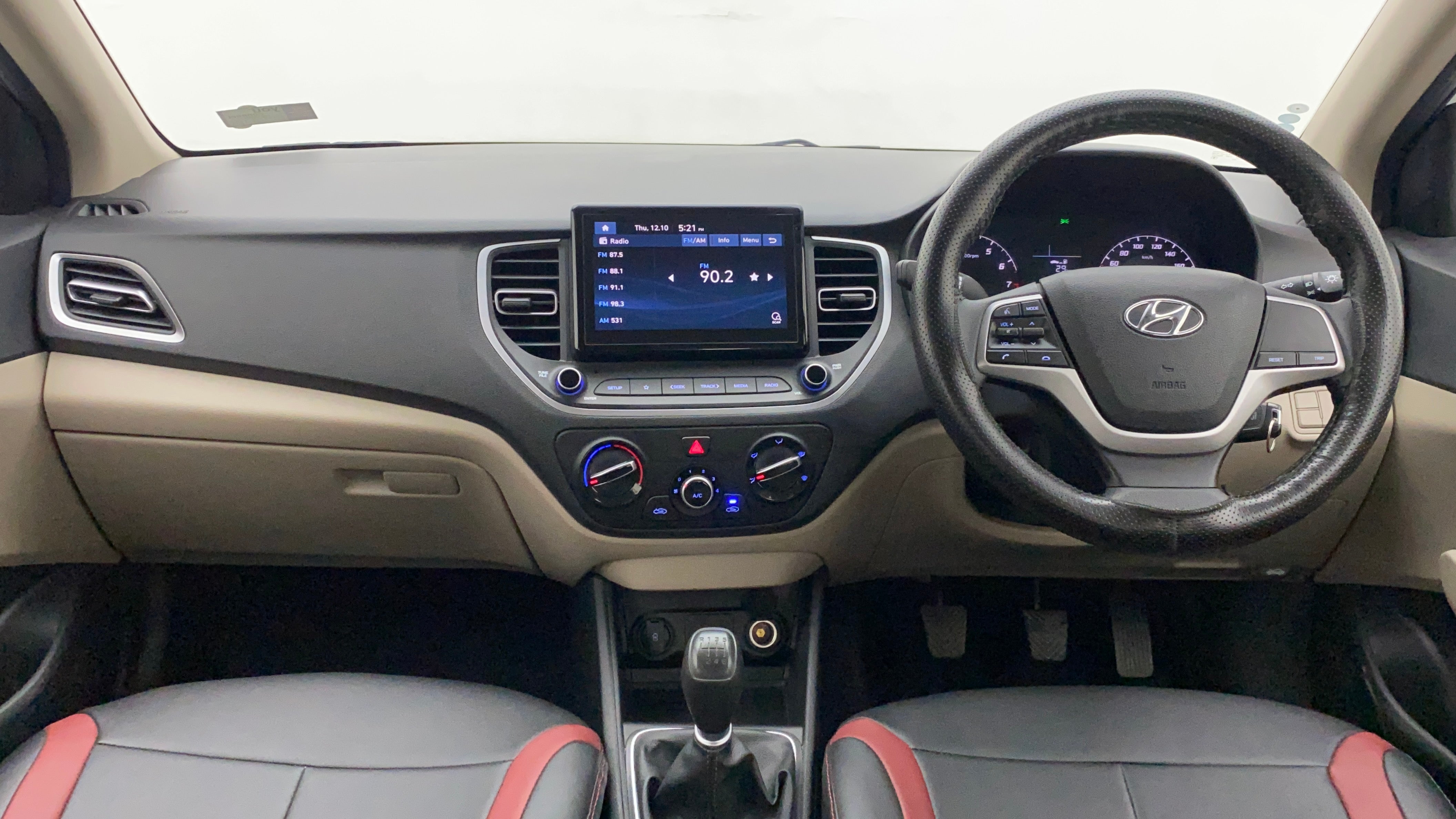 Dashboard and steering wheel view of a Hyundai Verna