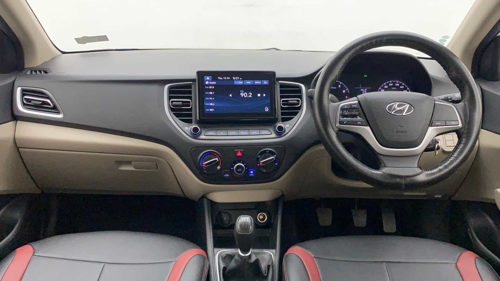 Dashboard and steering wheel view of a Hyundai Verna