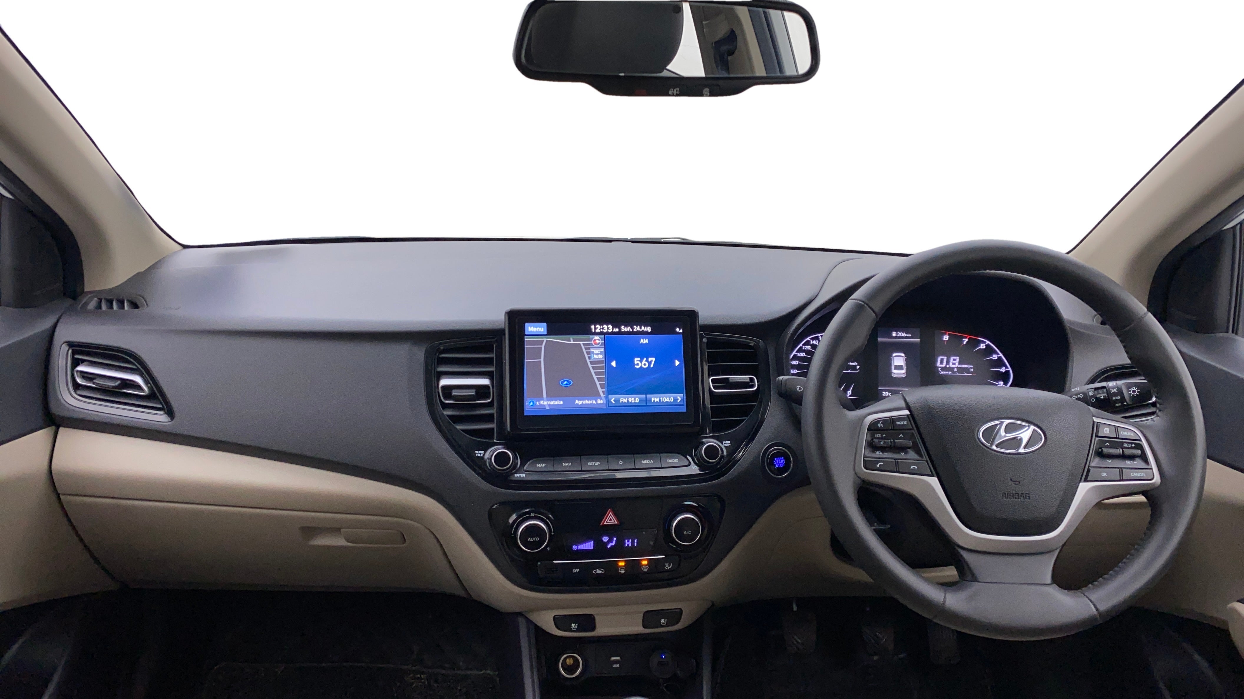 Dashboard and steering wheel view of a Hyundai Verna