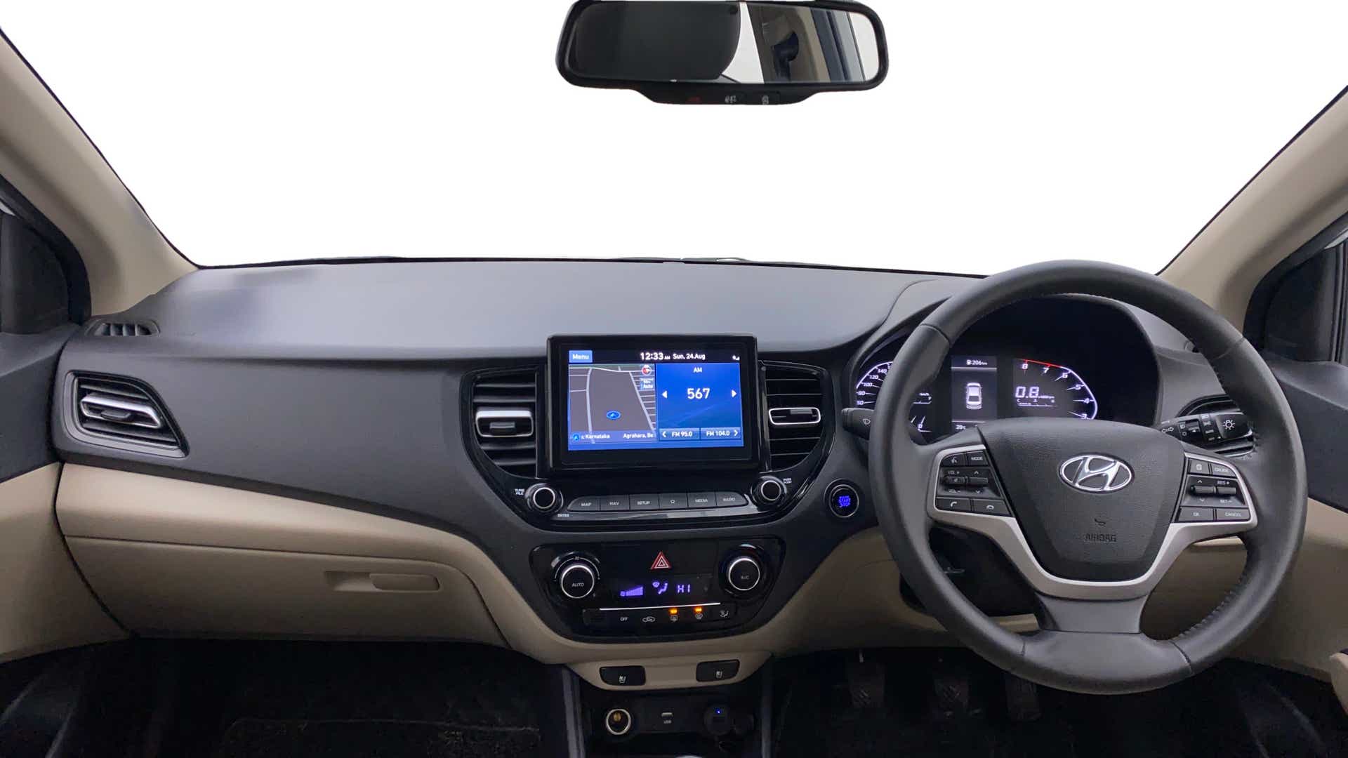 Dashboard and steering wheel view of a Hyundai Verna