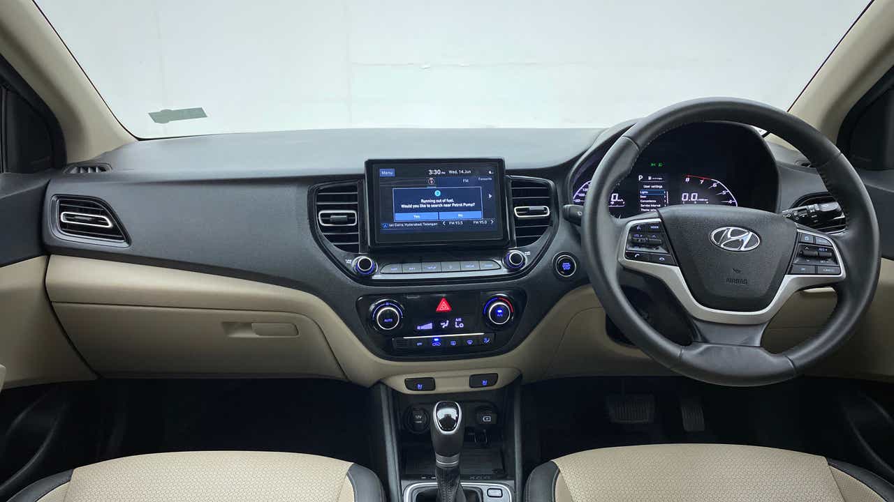 Dashboard and steering wheel view of a Hyundai Verna