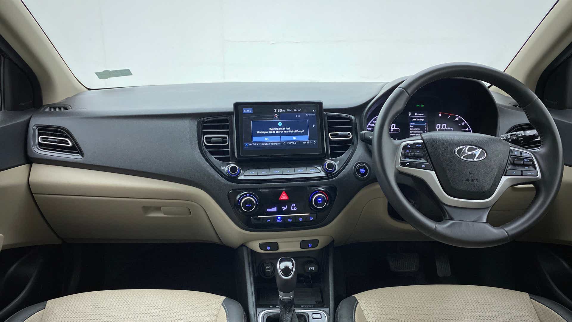 Dashboard and steering wheel view of a Hyundai Verna