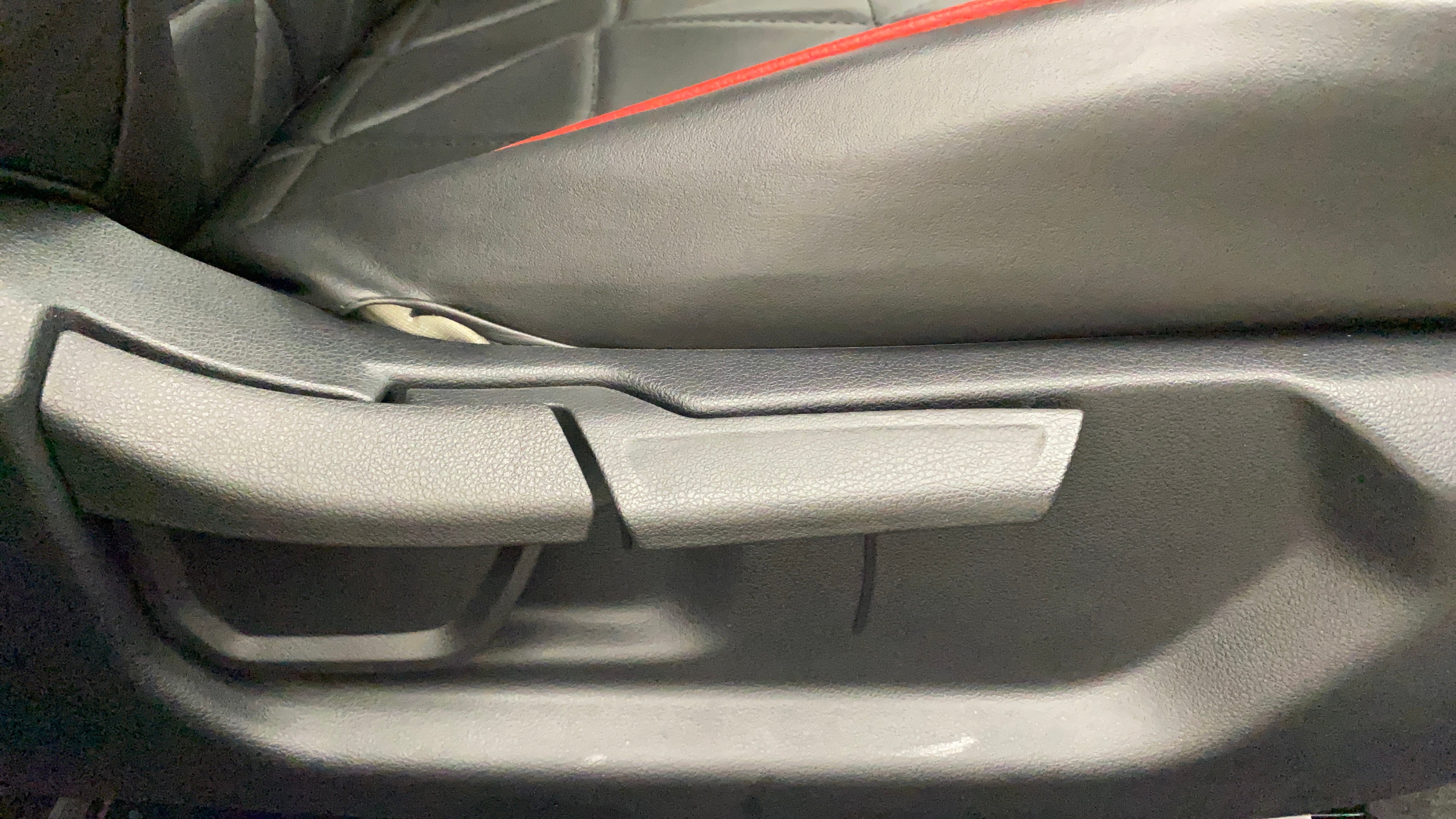 Seat adjustment lever close-up of a Hyundai Verna