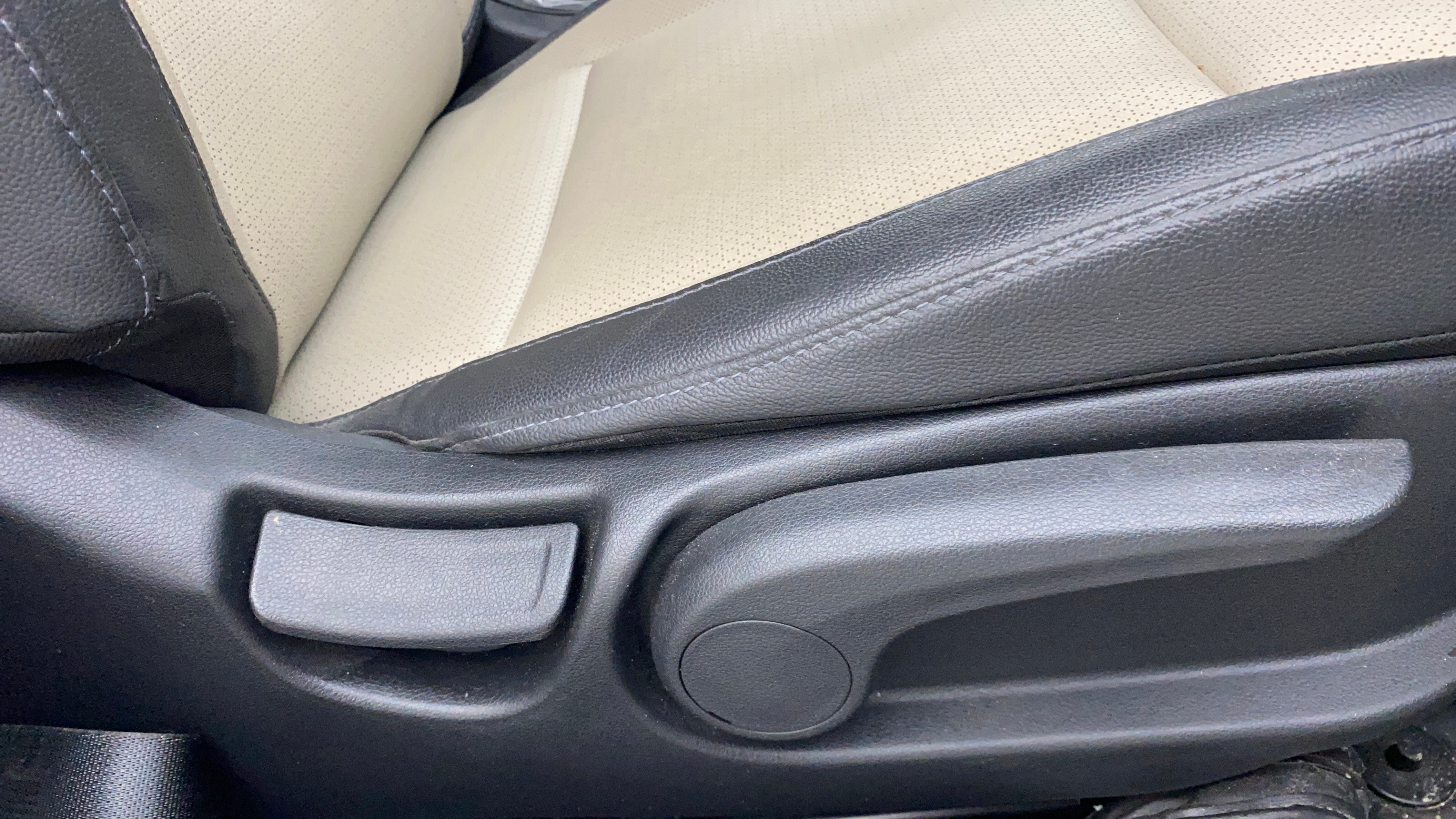 Close-up of a seat adjuster lever in a Hyundai Verna
