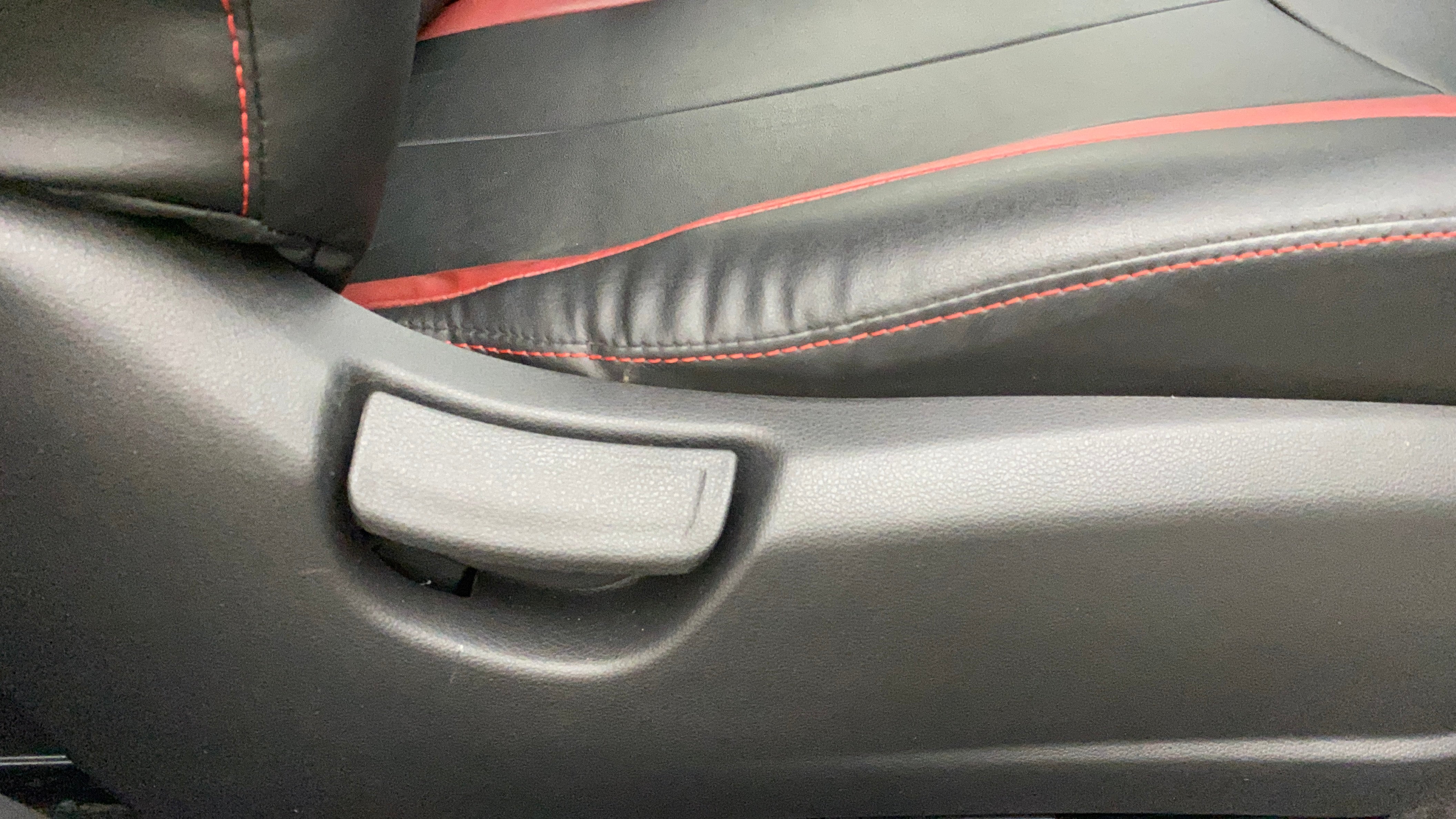 Close-up of a seat adjustment lever of a Hyundai Verna