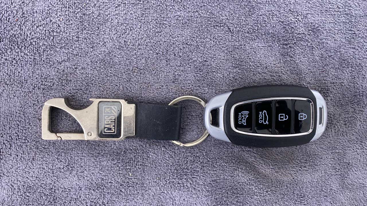 Top view of a Hyundai Verna key fob with keychain