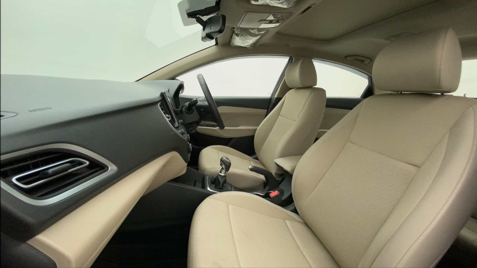 Interior dashboard and front seats of a Hyundai Verna