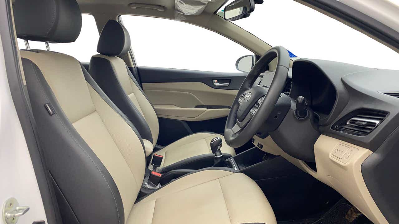 Interior front seats and dashboard of a Hyundai Verna