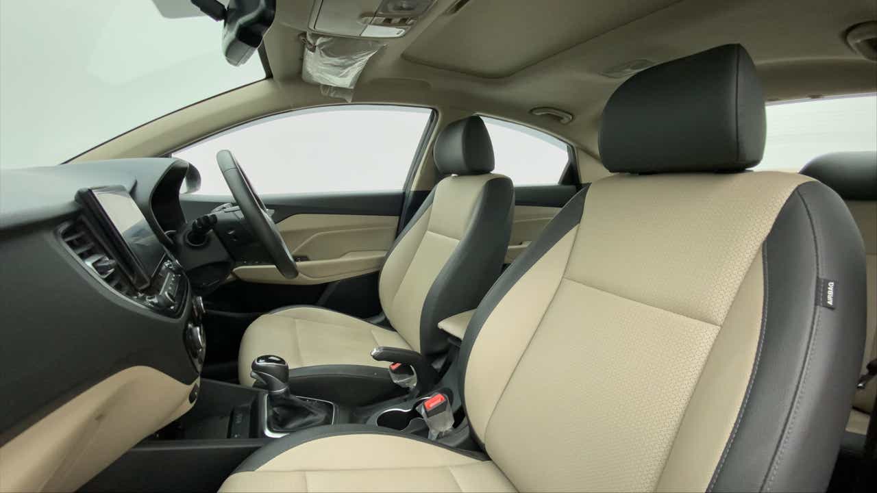 Front seat and dashboard interior of a Hyundai Verna