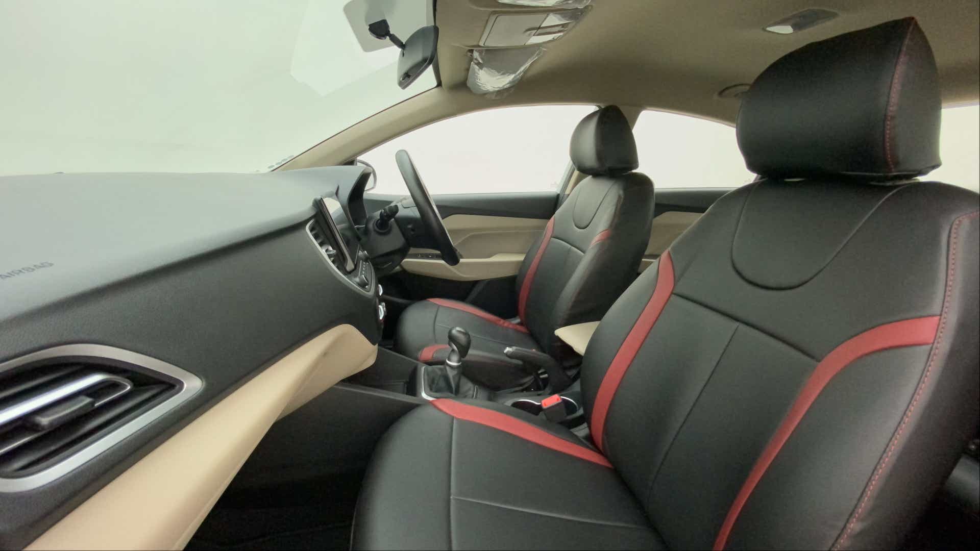 Interior front seats and dashboard of a Hyundai Verna