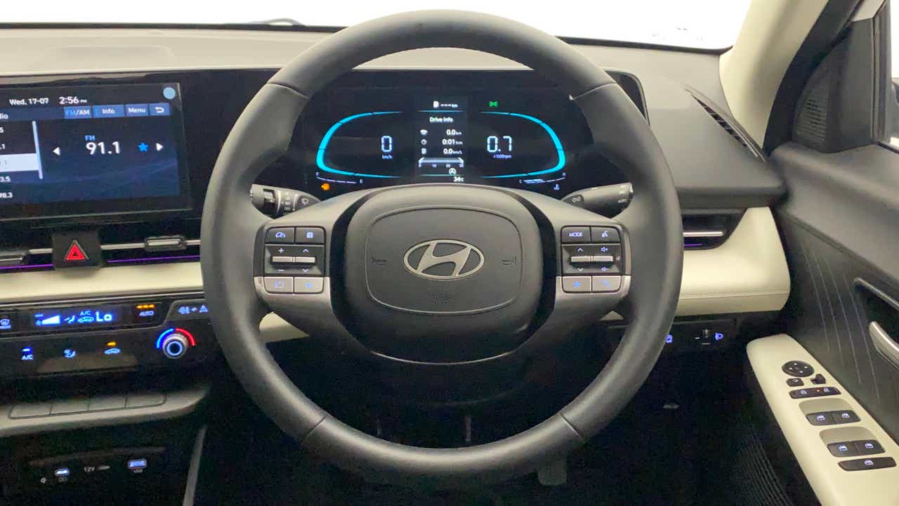 Steering wheel and dashboard view of a Hyundai Verna