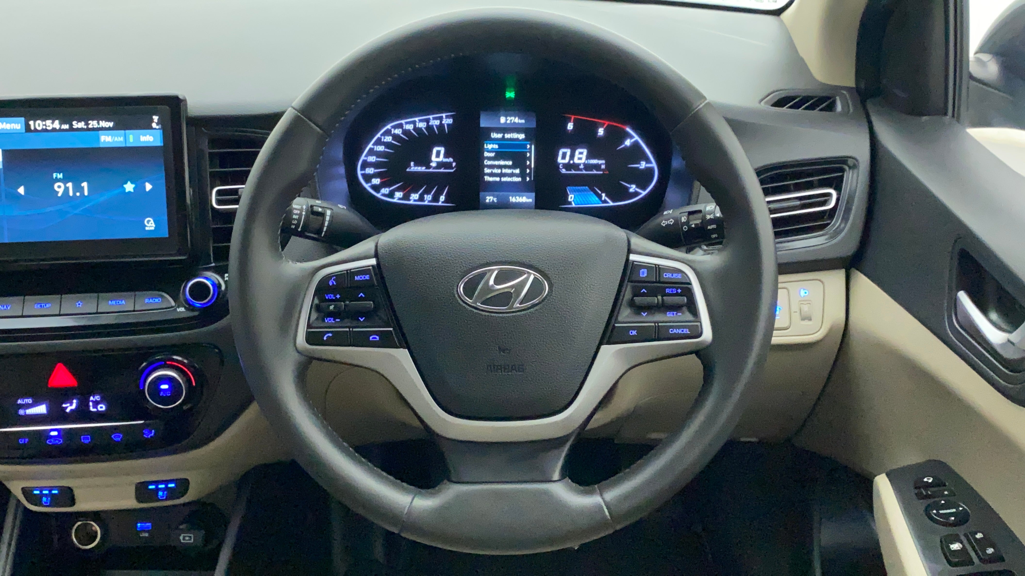 Interior dashboard and steering wheel of a Hyundai Verna