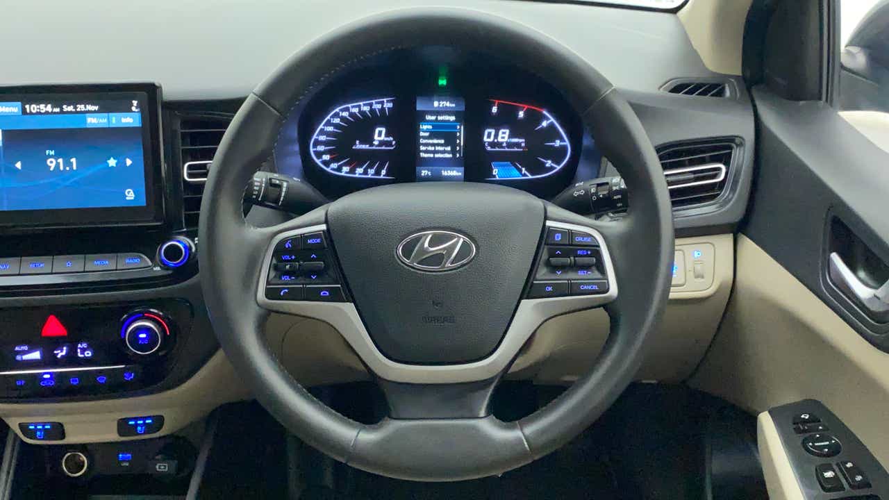 Interior dashboard and steering wheel of a Hyundai Verna