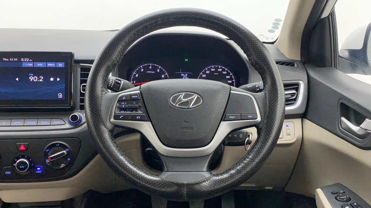Dashboard and steering wheel view of a Hyundai Verna