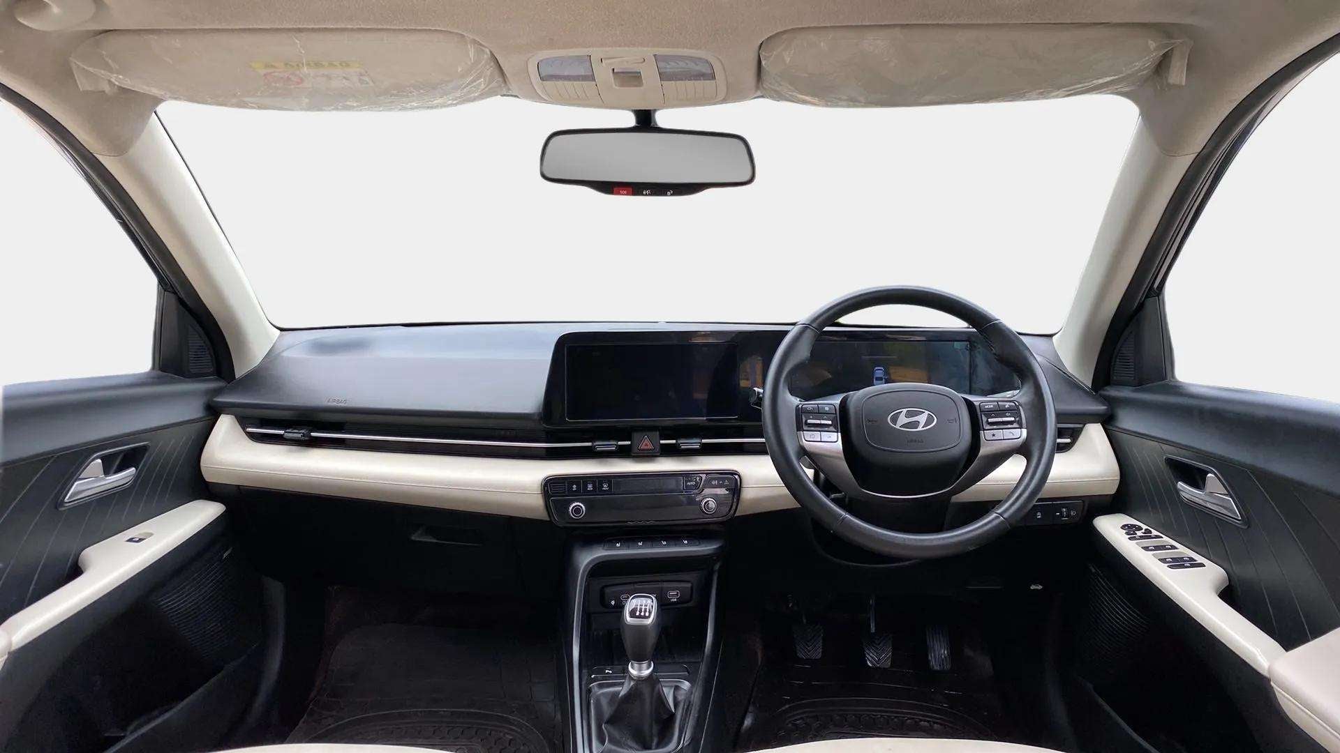 Dashboard and steering wheel view of a Hyundai Verna