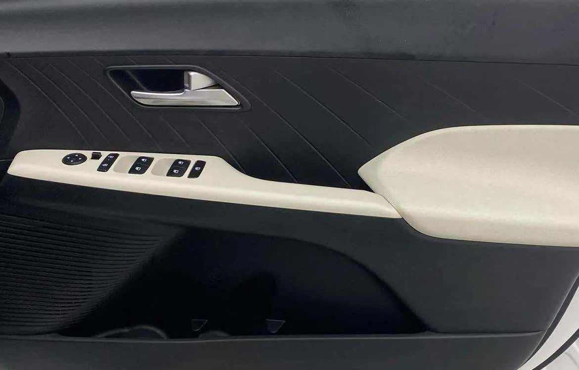 Front door panel controls of a Hyundai Verna