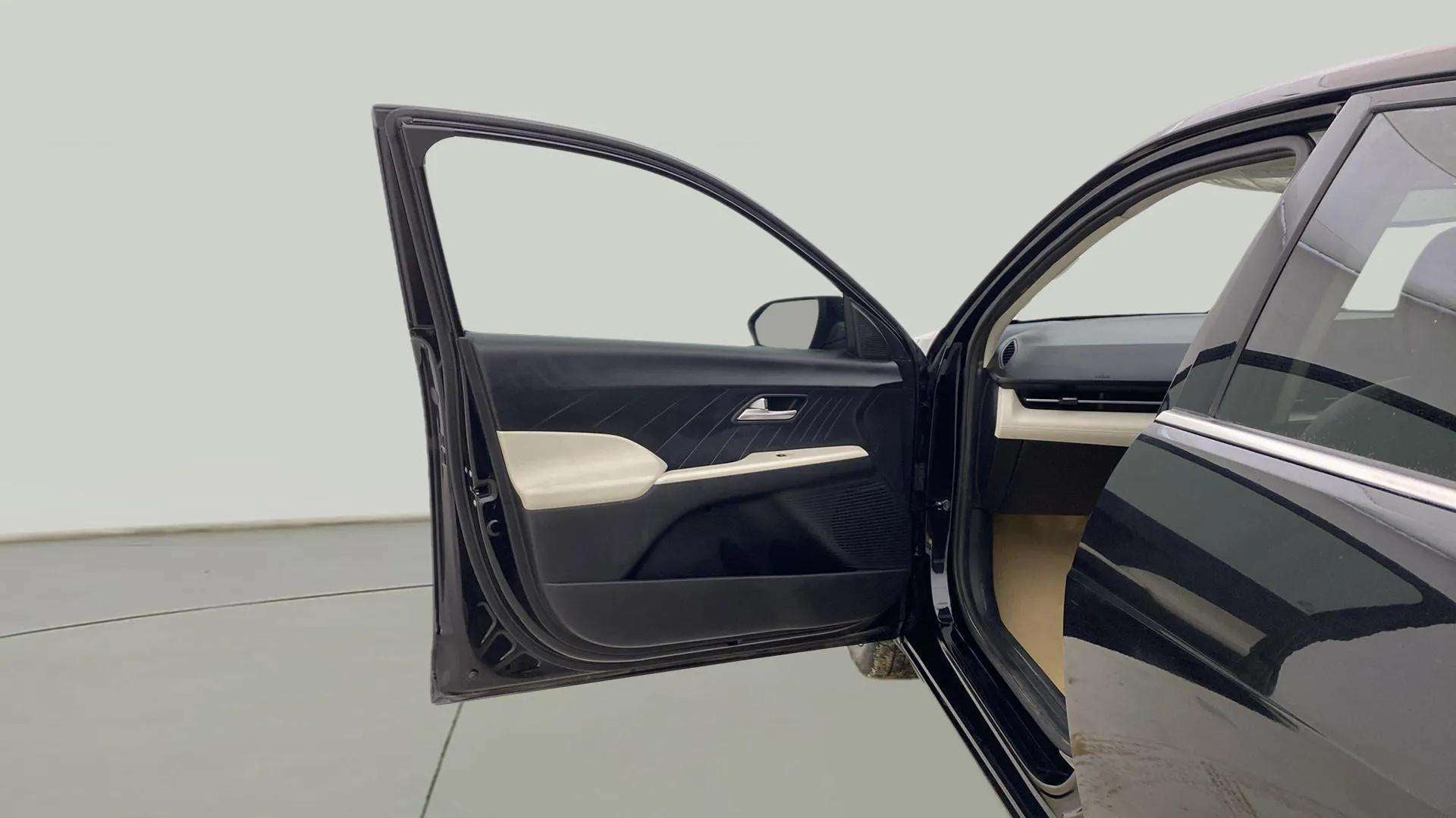 Front driver side door open view of a Hyundai Verna