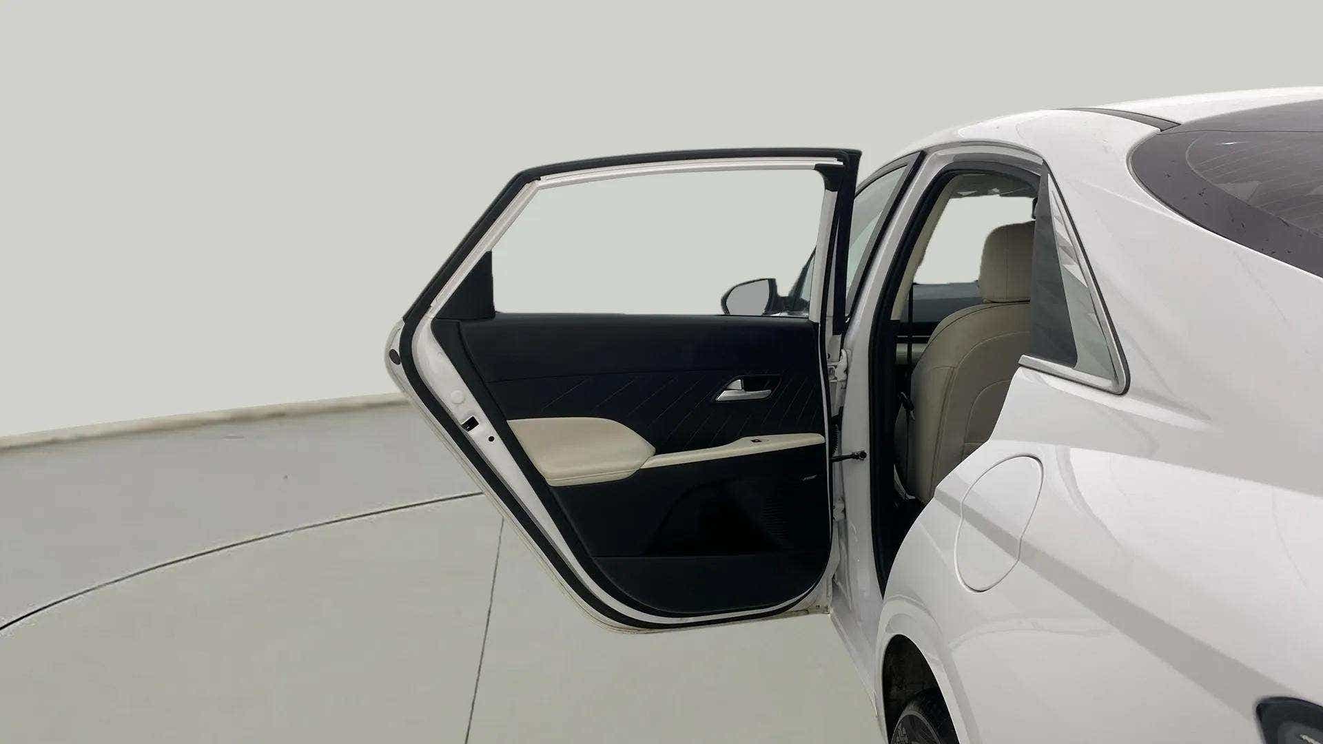 Rear door open view of a Hyundai Verna