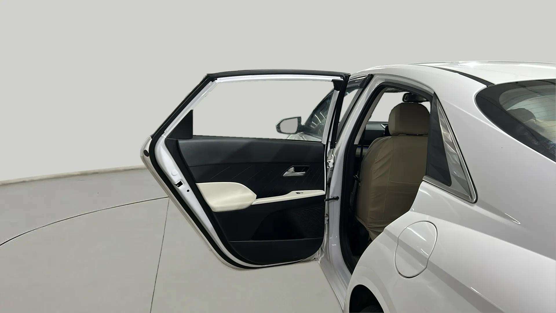 Rear door open view of a Hyundai Verna