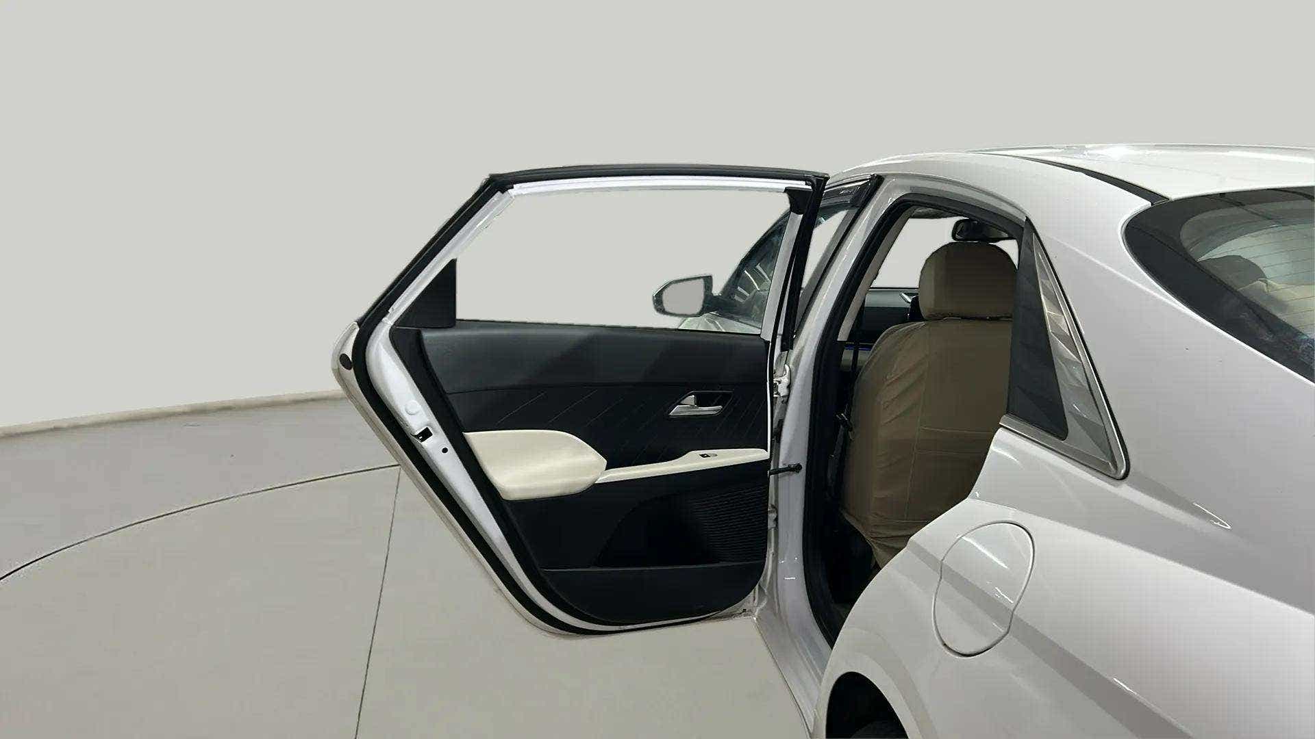 Rear door open view of a Hyundai Verna
