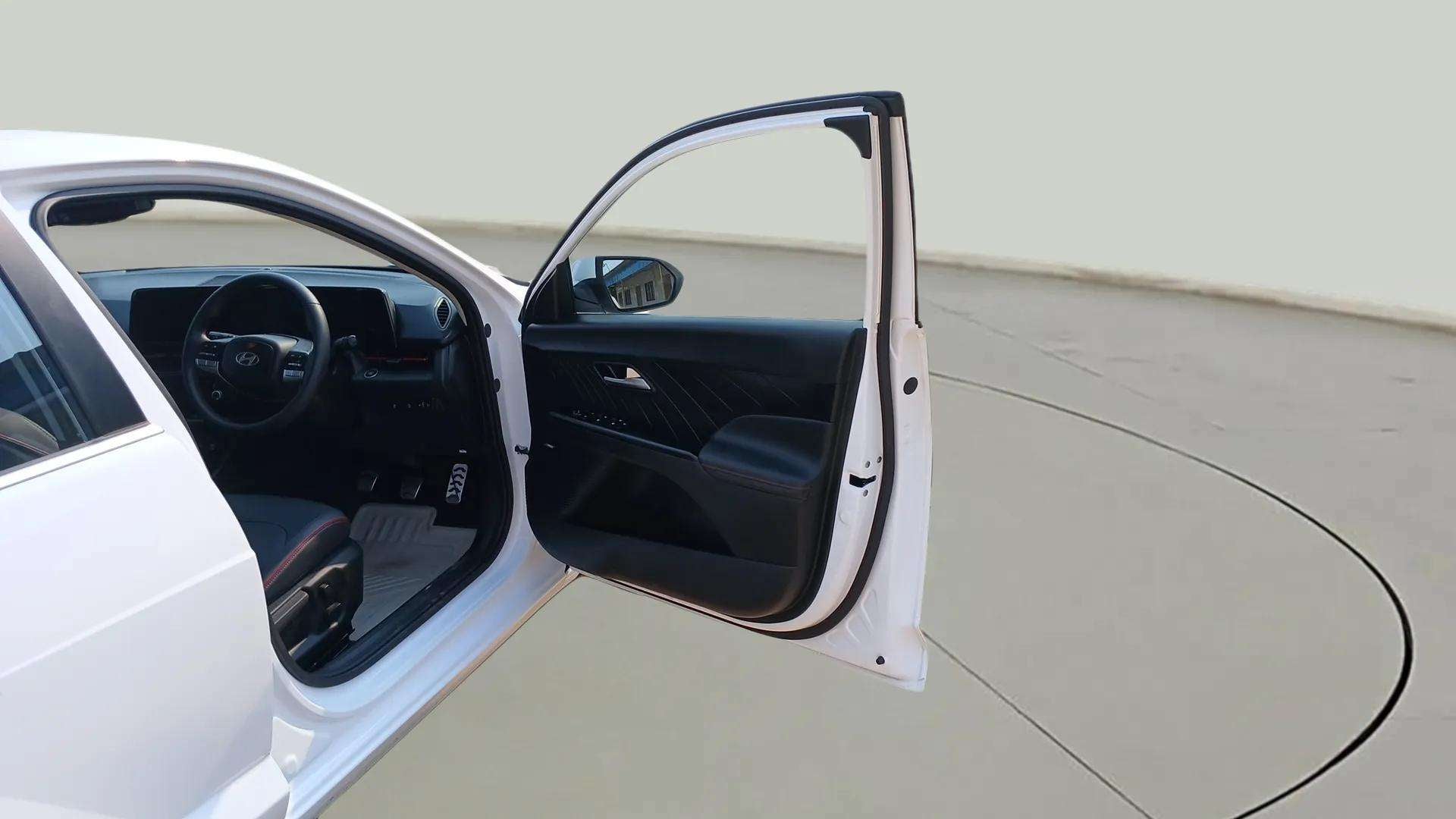 Driver seat and dashboard view of a Hyundai Verna