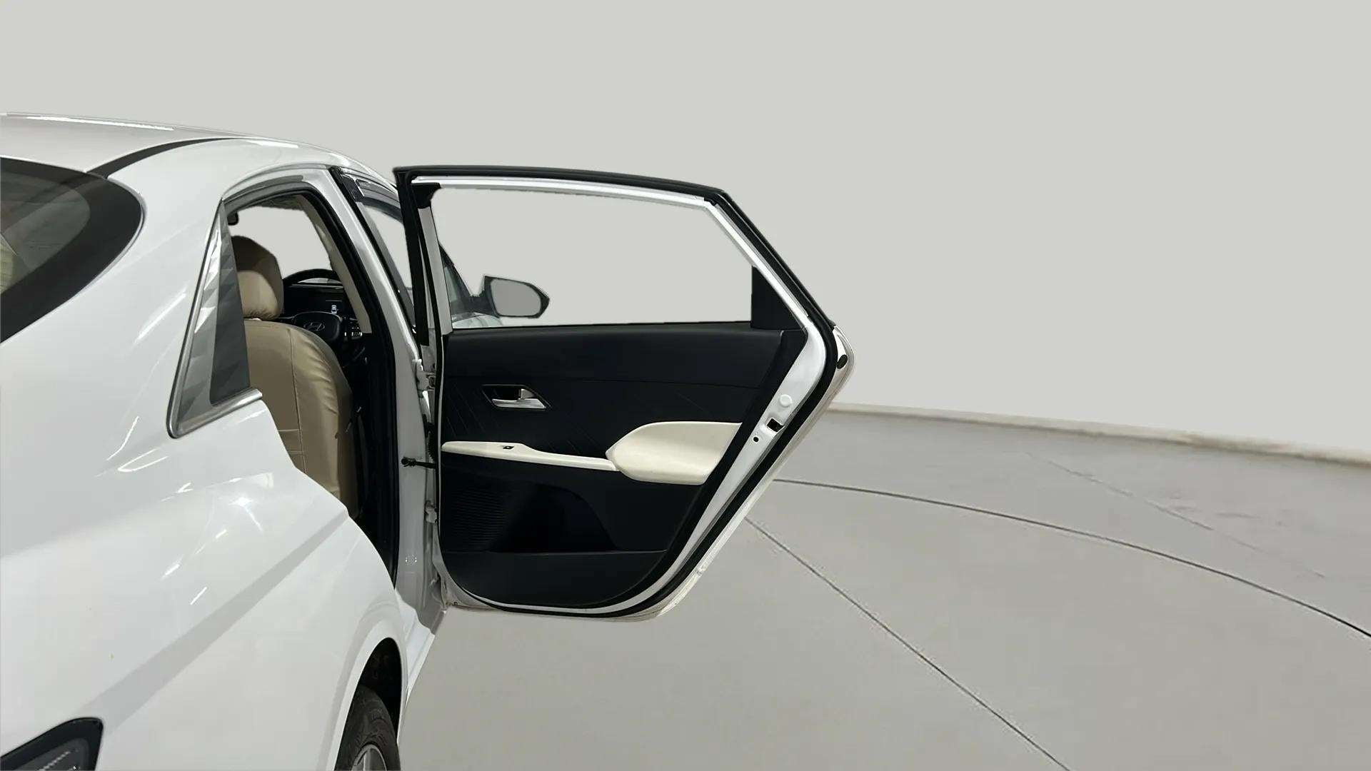 Rear left door open view of a Hyundai Verna