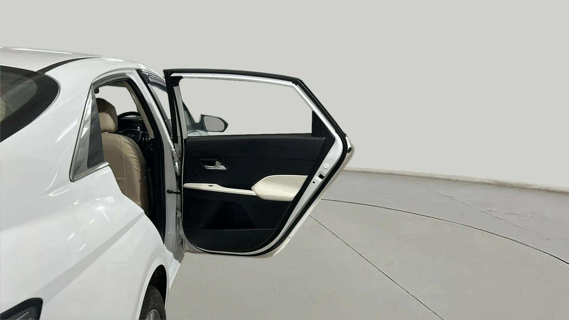 Rear left door open view of a Hyundai Verna
