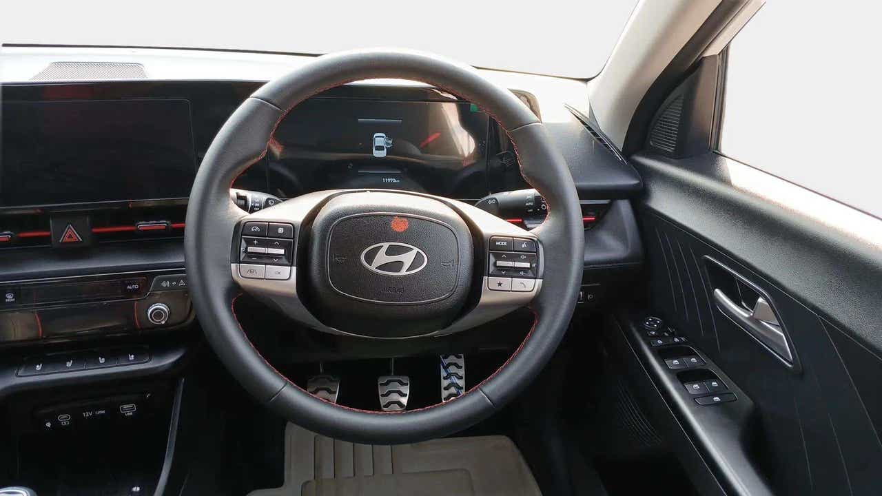 Steering wheel and dashboard view of a Hyundai Verna