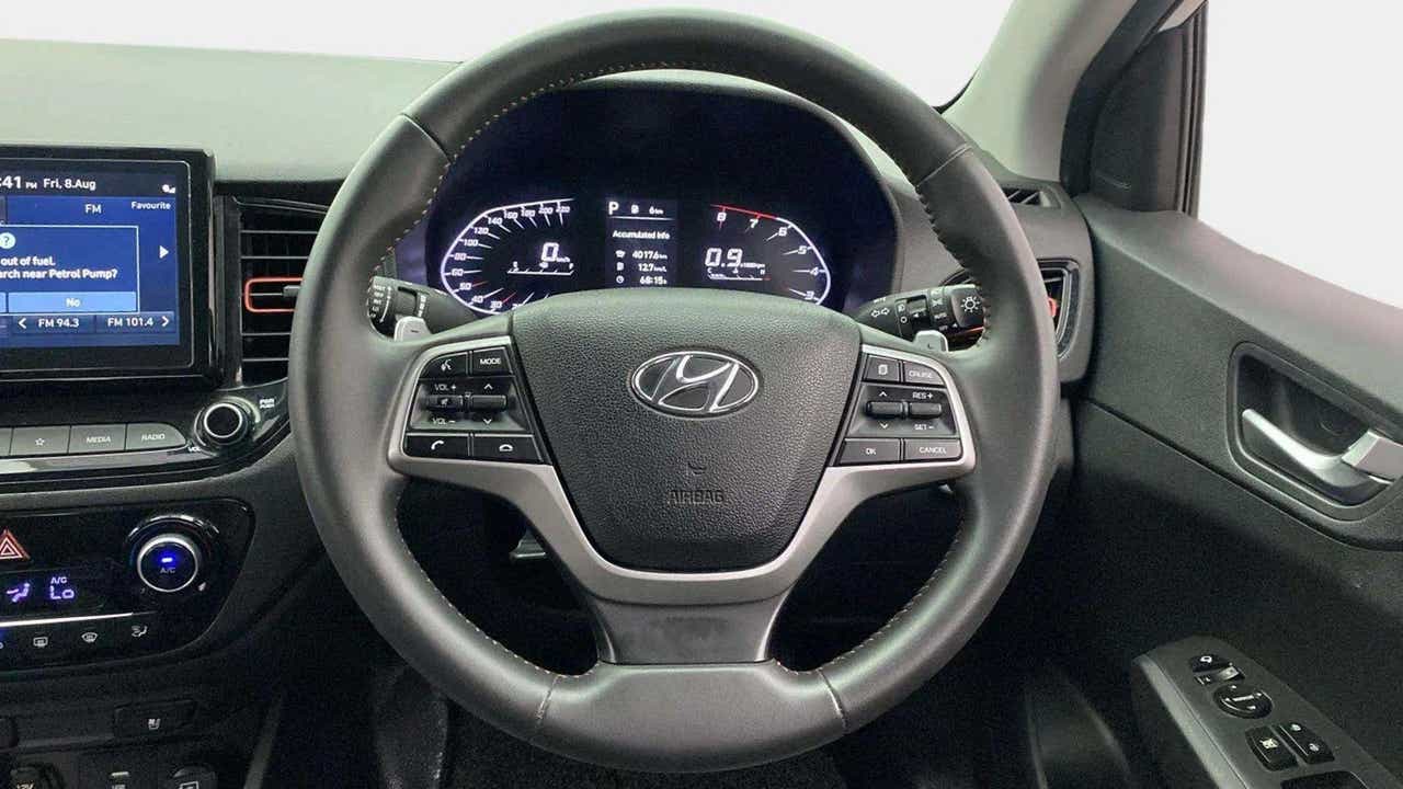 Steering wheel and dashboard view of a Hyundai Verna