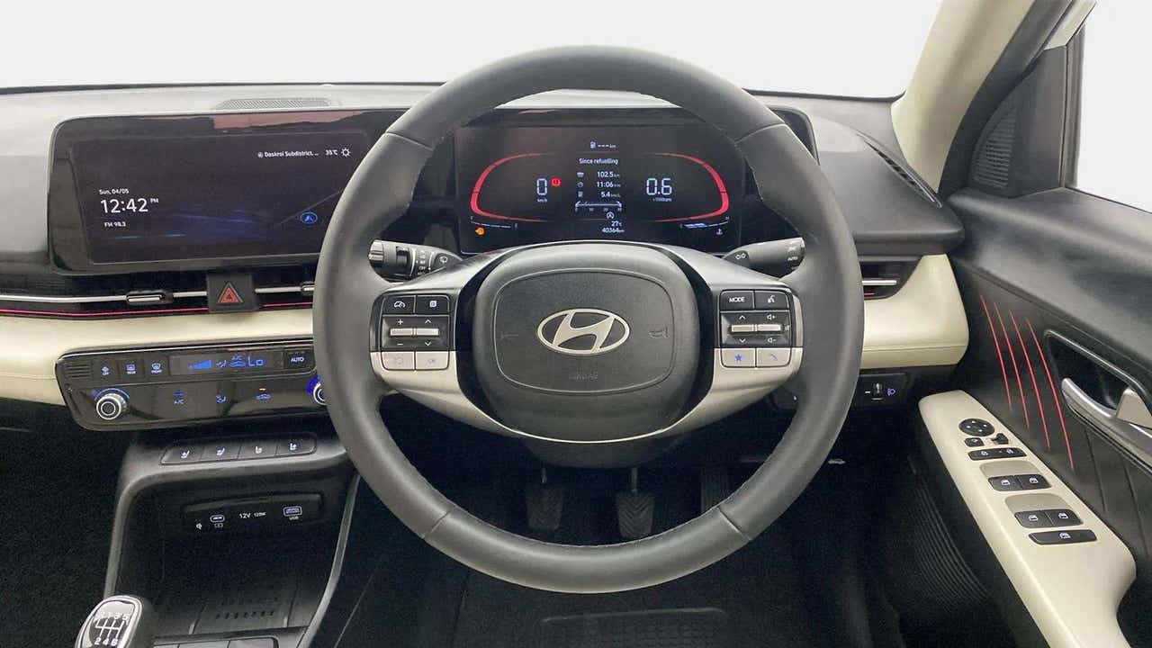 Interior dashboard and steering wheel of a Hyundai Verna